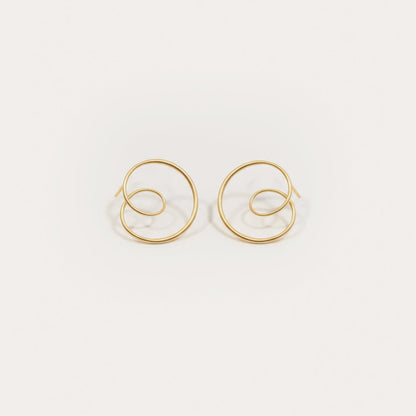 Gold hoop earrings on a white background