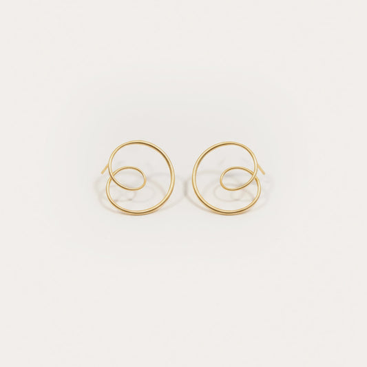 Gold hoop earrings on a white background