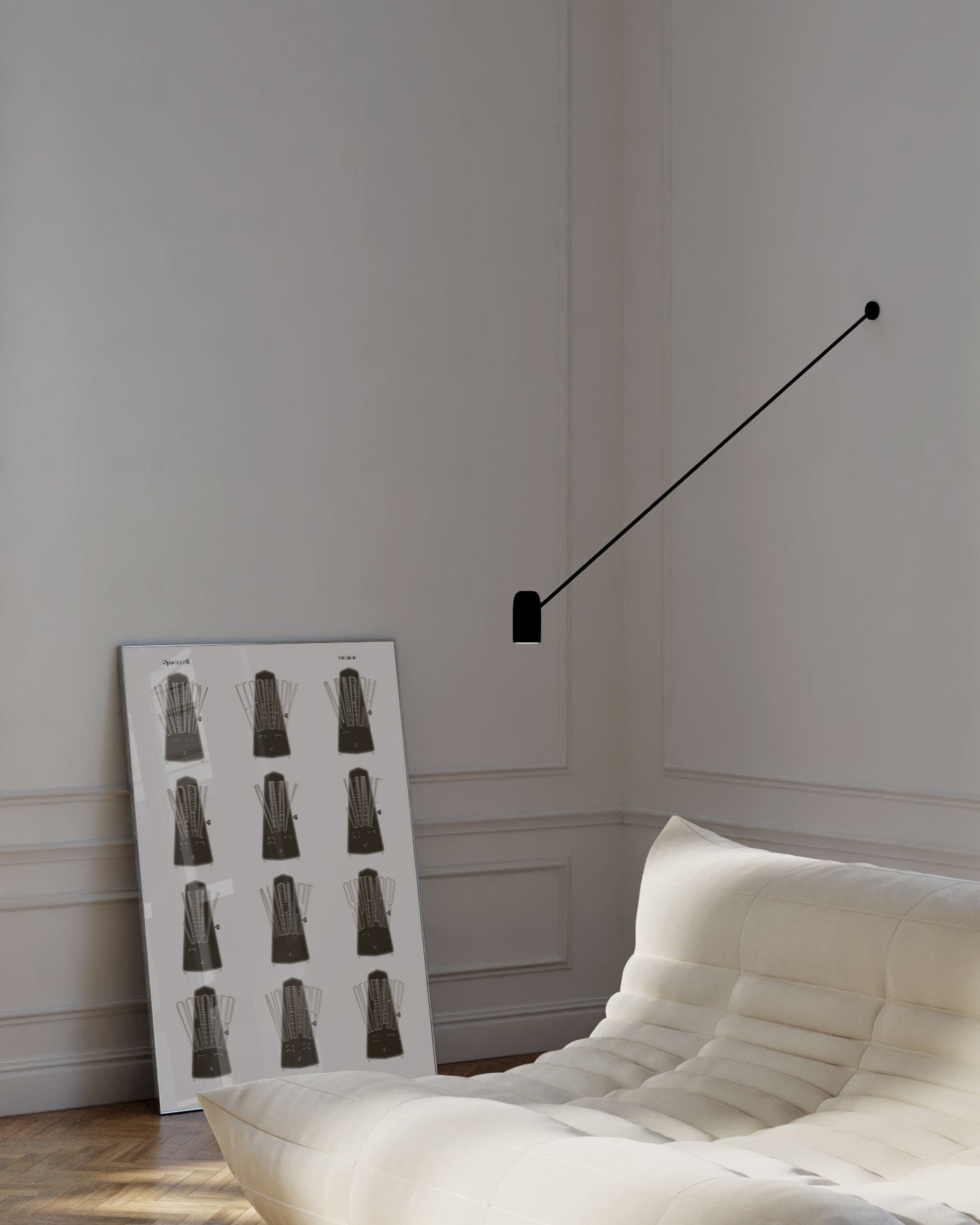 Modern wall lamp fixture in a minimalistic room with a white sofa and decorative wall art.