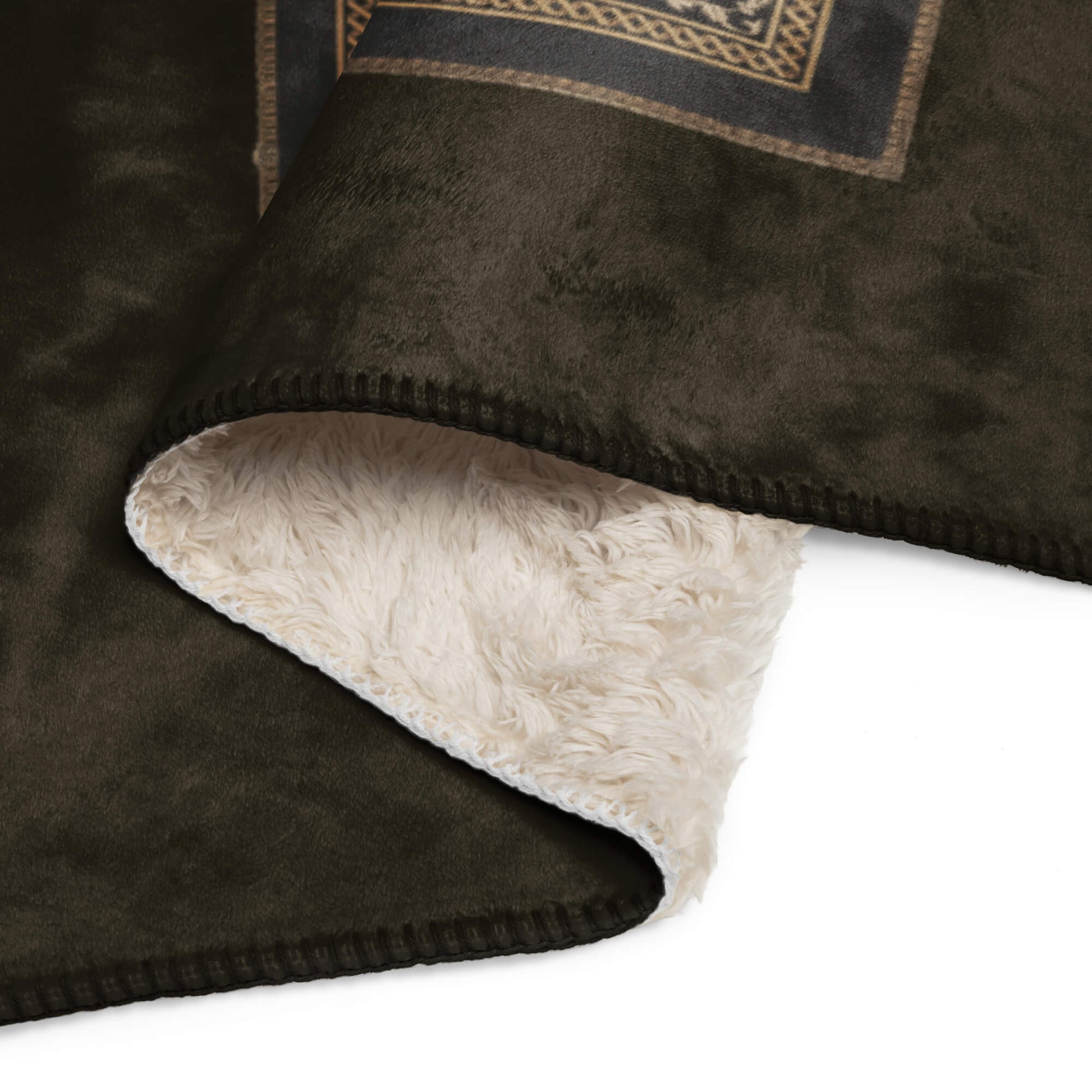 Brown blanket with beige fleece lining on a white background